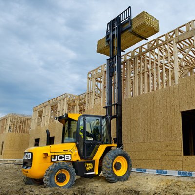 Forklift unloading machinery and industrial equipment in Woking